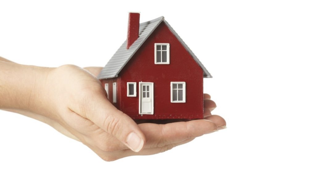 Affordable housing, image of house in a hand