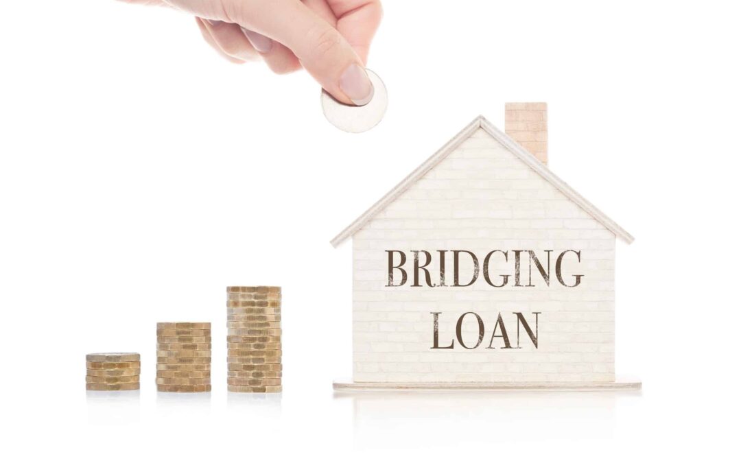 Image of the words bridging loans on a house next to money